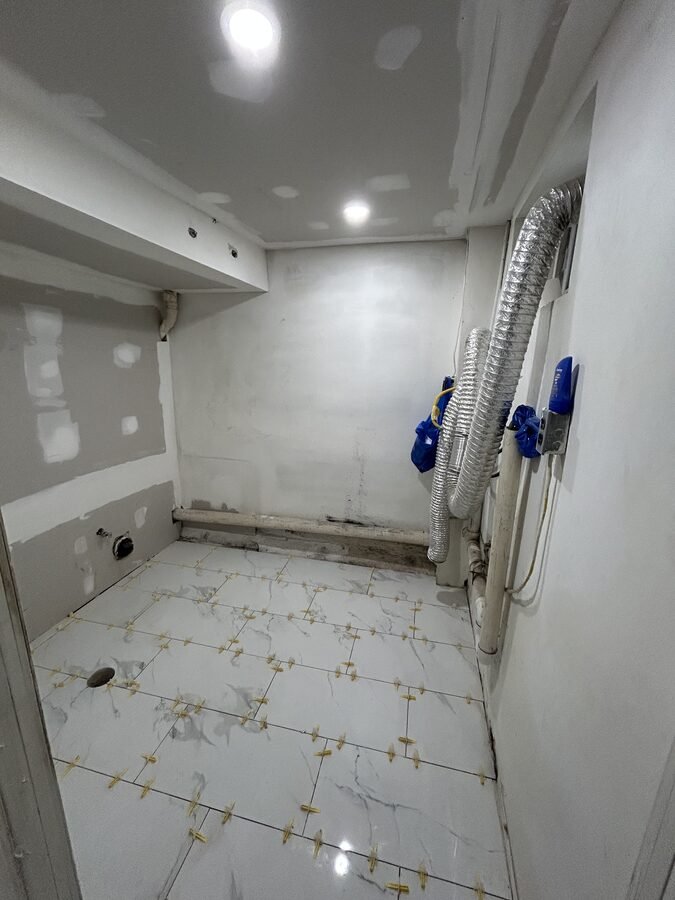 Laundry and bathroom rough-in work before finish installation