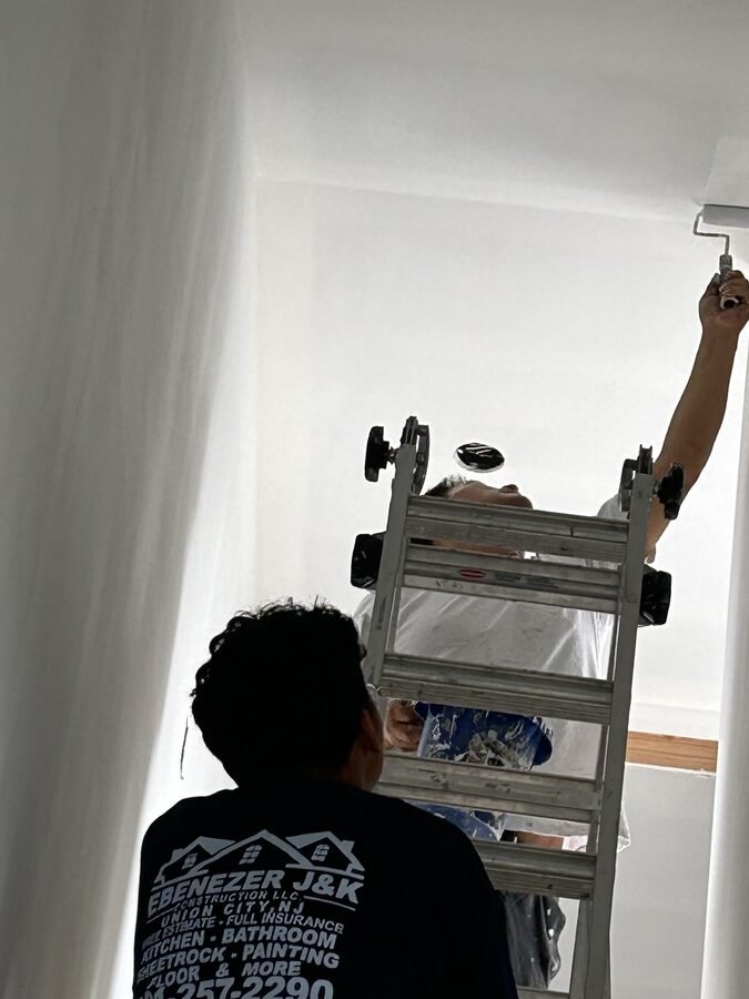 Painting and sheetrock work in progress with prepared wall surfaces