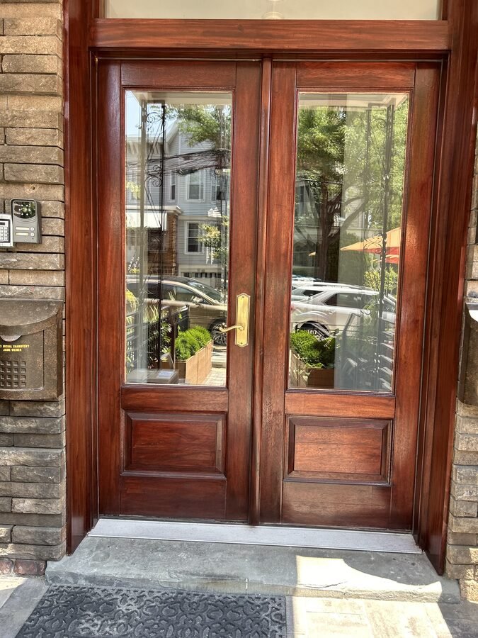 Wood entry door finish detail with exterior trim work